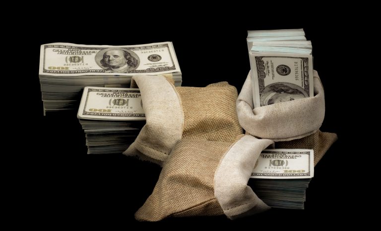 Sack of money 100 USD dollars banknotes a lot of money